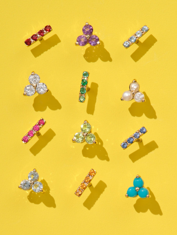 Tri-Ruby Yellow Gold Stud